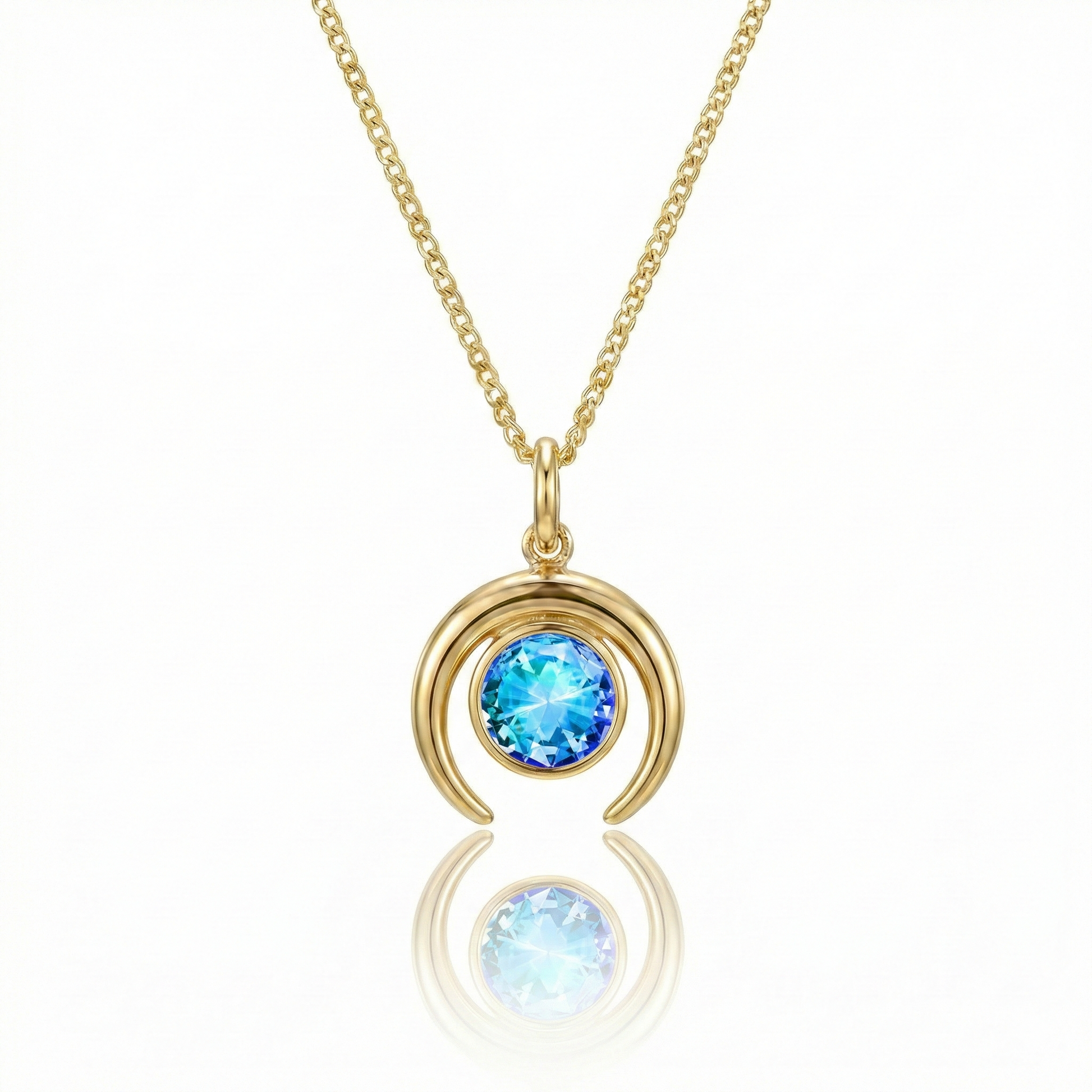 Gold crescent necklace with a blue gemstone pendant.