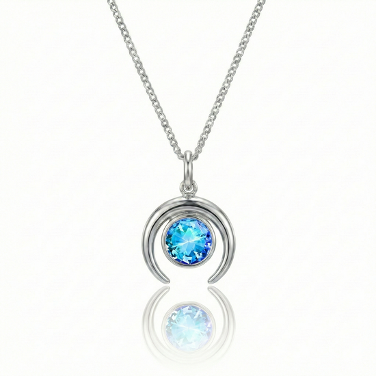 Silver crescent necklace with a blue gemstone pendant.