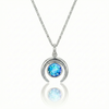 Silver crescent necklace with a blue gemstone pendant.