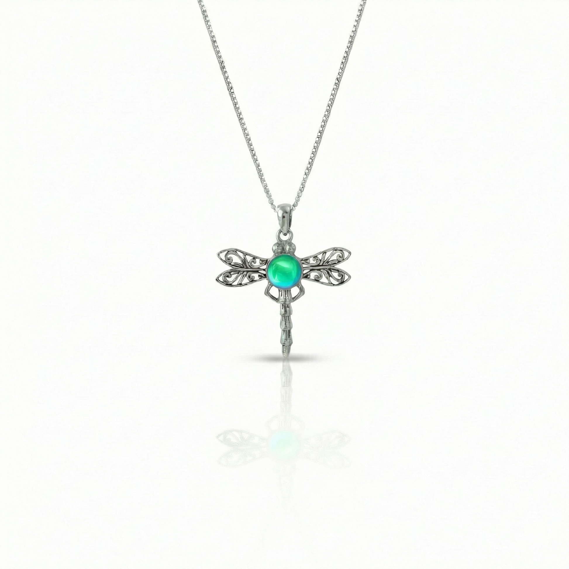 Dragonfly Pendant, this handmade pendant features a stunning glowing polished green crystal, elegantly surrounded by intricate silver details in the dragonfly's wings and body. The pendant comes with an 18" sterling silver .7mm box chain included.