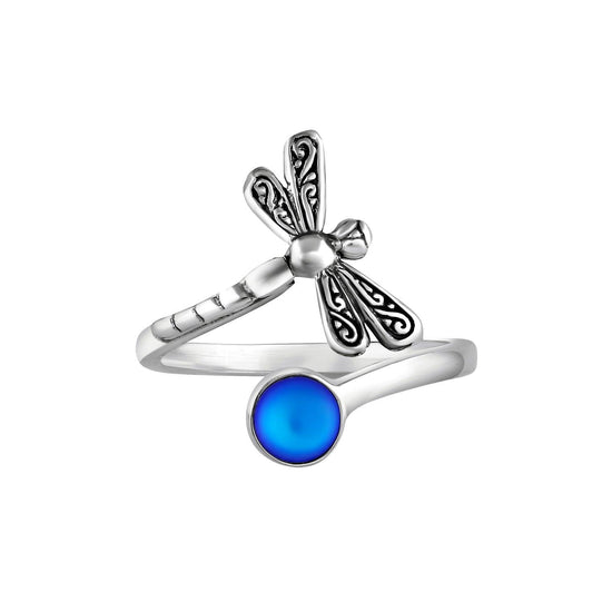 Dragonfly Ring, this adjustable handmade ring features a stunning glowing frosted blue crystal, elegantly surrounded by intricate silver details in the wings and body of the dragonfly.