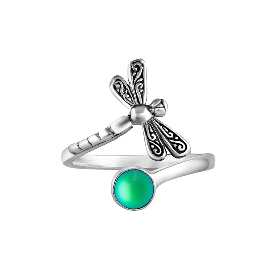 Dragonfly Ring, this adjustable handmade ring features a stunning glowing frosted green crystal, elegantly surrounded by intricate silver details in the wings and body of the dragonfly.