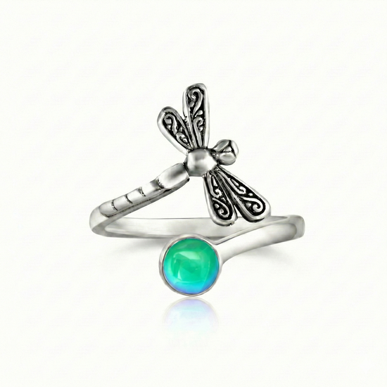 Dragonfly Ring, this adjustable handmade ring features a stunning glowing 5mm polished green crystal, elegantly surrounded by intricate silver details in the wings and body of the dragonfly.