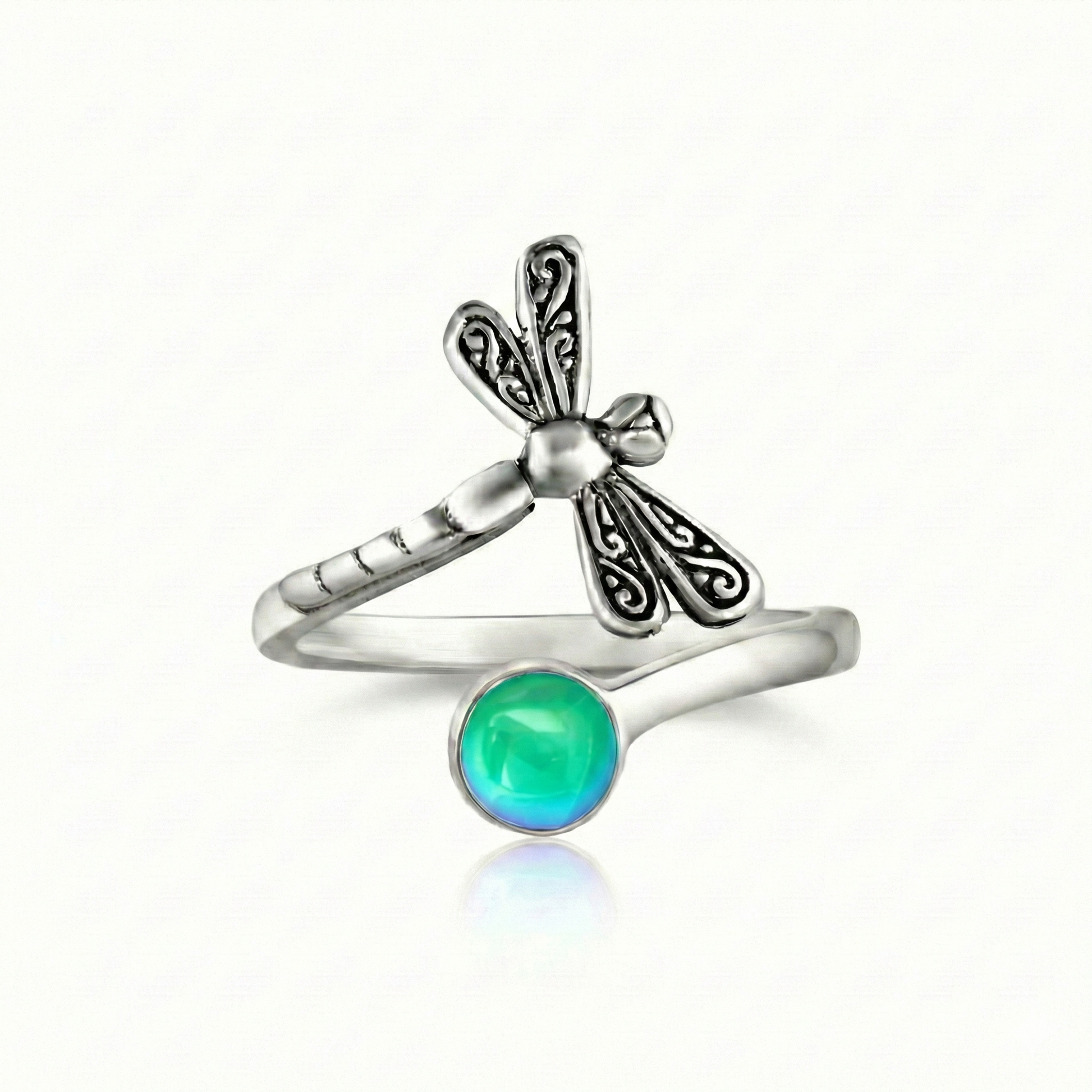 Dragonfly Ring, this adjustable handmade ring features a stunning glowing 5mm polished green crystal, elegantly surrounded by intricate silver details in the wings and body of the dragonfly.