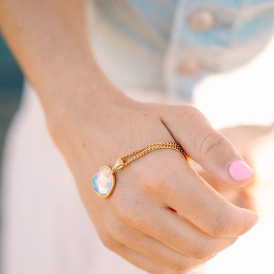 Eclipse Crystal Pendant, a mesmerizing blend of elegance and simplicity. Perfectly shaped, this pendant captures the allure of the night sky in a sleek, radiant design that reflects light beautifully from every angle.