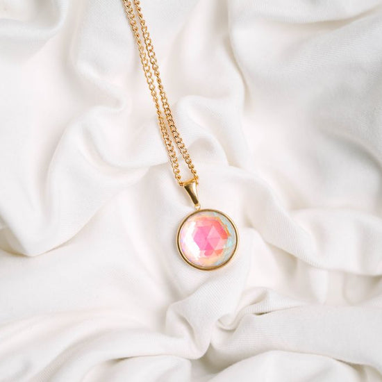 Eclipse Crystal Pendant, a mesmerizing blend of elegance and simplicity. Perfectly shaped, this pendant captures the allure of the night sky in a sleek, radiant design that reflects light beautifully from every angle.
