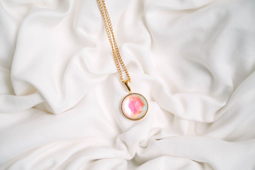 Eclipse Crystal Pendant, a mesmerizing blend of elegance and simplicity. Perfectly shaped, this pendant captures the allure of the night sky in a sleek, radiant design that reflects light beautifully from every angle.
