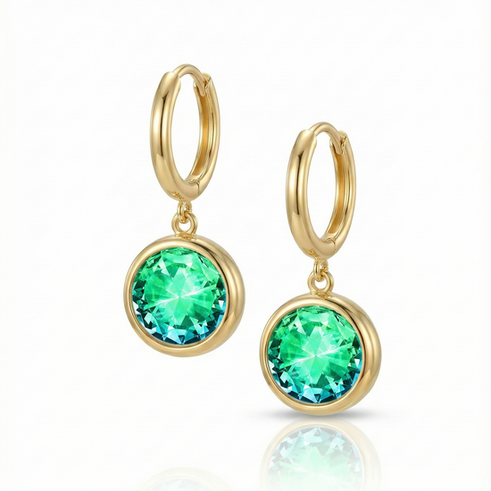 Eclipse Hoop Earrings are perfectly sized with a 9mm round green circle and an 11mm 18K gold stainless hoop diameter. These earrings are crafted to add a subtle yet striking touch of sophistication to your everyday ensemble.