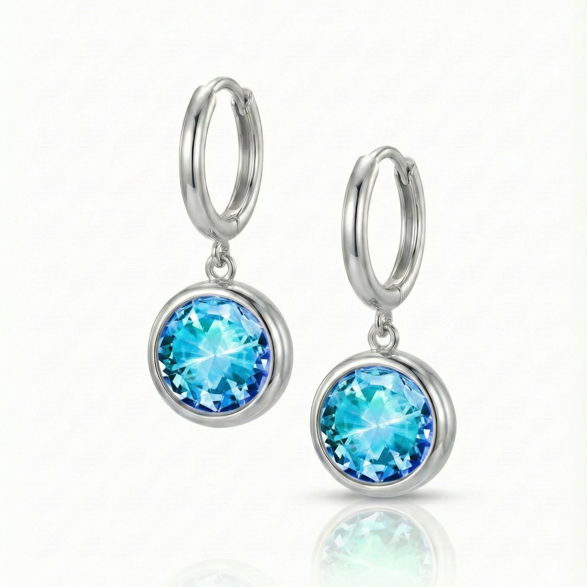 Eclipse Hoop Earrings are perfectly sized with a 9mm round blue circle and an 11mm silver stainless hoop diameter. These earrings are crafted to add a subtle yet striking touch of sophistication to your everyday ensemble.