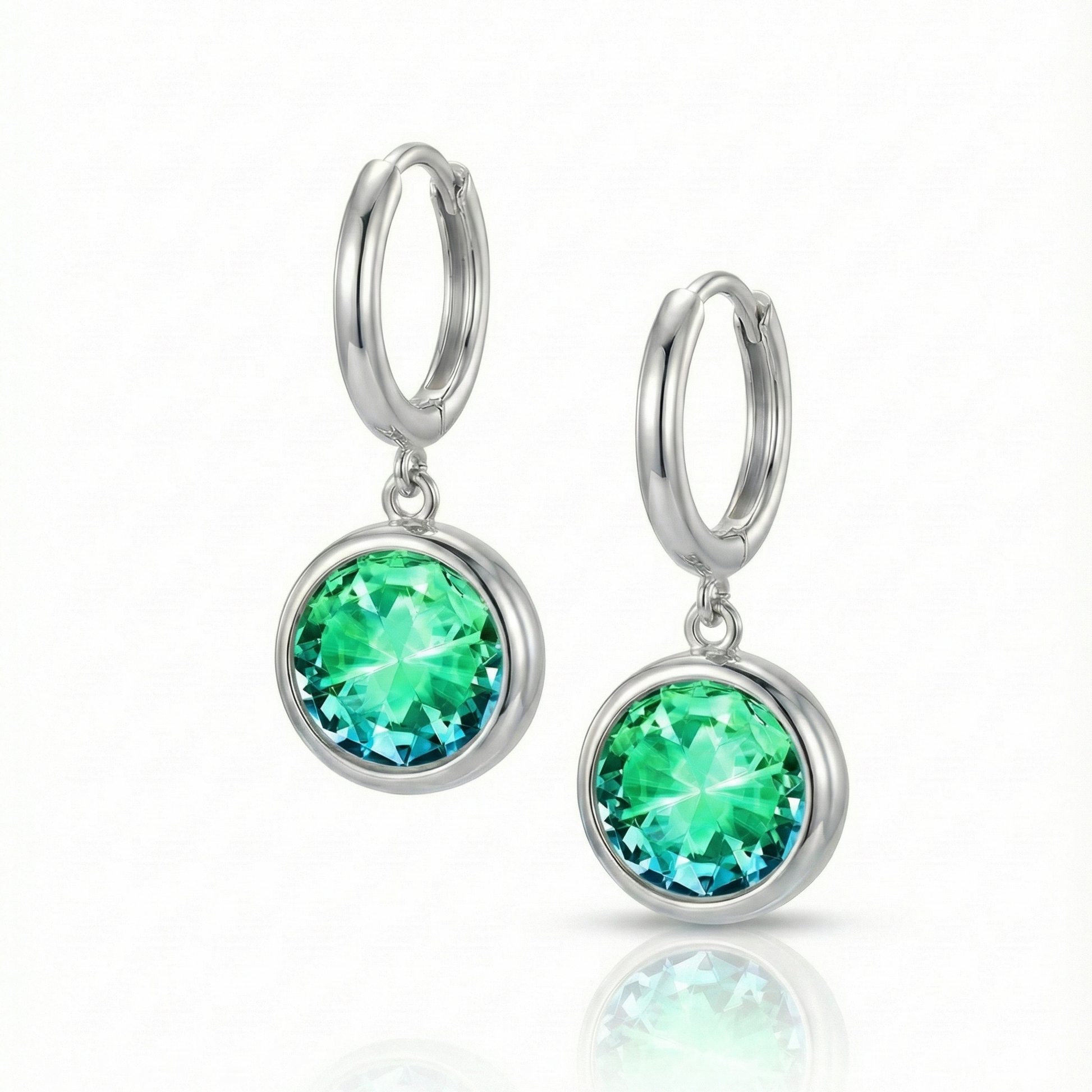 Eclipse Hoop Earrings are perfectly sized with a 9mm round green circle and an 11mm silver stainless hoop diameter. These earrings are crafted to add a subtle yet striking touch of sophistication to your everyday ensemble.