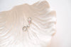Perfectly sized with a 9mm circle, these earrings are crafted to add a subtle yet striking touch of sophistication to your everyday ensemble. Inspired by the celestial beauty of an eclipse, the minimalist design highlights a radiant crystal that catches the light with every move.
