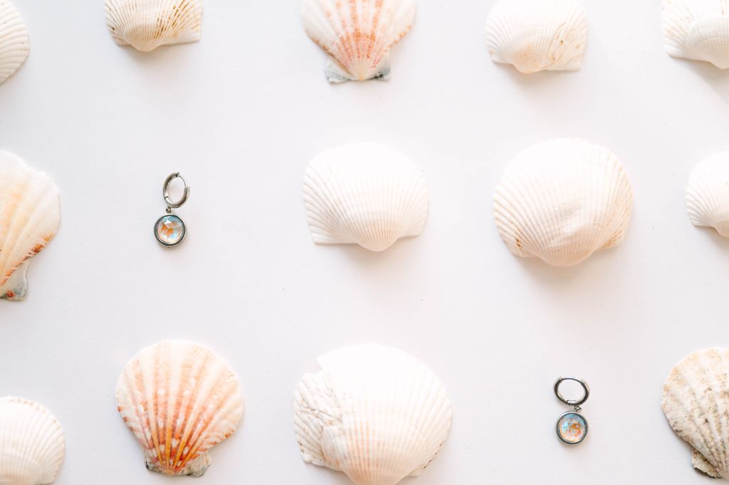  Perfectly sized with a 9mm circle, these earrings are crafted to add a subtle yet striking touch of sophistication to your everyday ensemble. Inspired by the celestial beauty of an eclipse, the minimalist design highlights a radiant crystal that catches the light with every move.