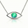 Silver necklace with a green gemstone eye pendant.