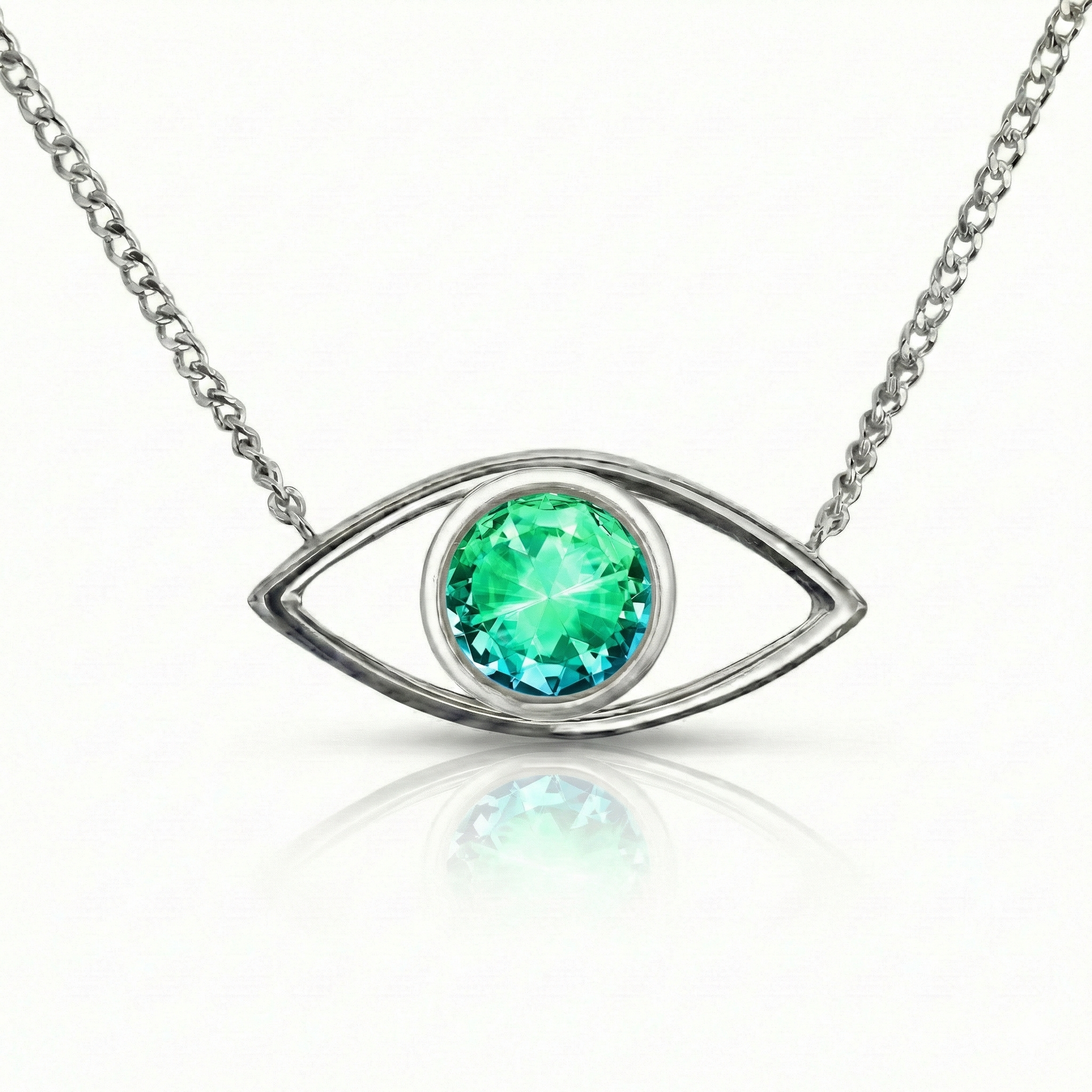 Silver necklace with a green gemstone eye pendant.