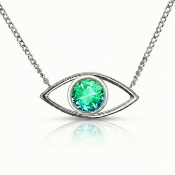 Silver necklace with a green gemstone eye pendant.