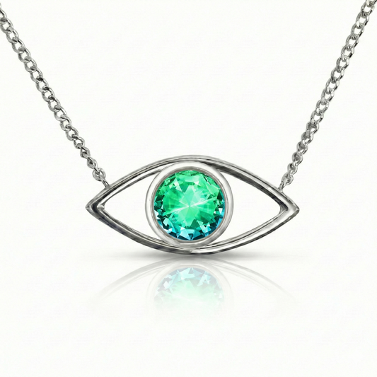 Silver necklace with a green gemstone eye pendant.