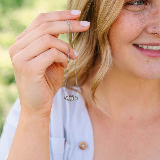 Evil Eye Necklace, a stunning addition to our Pendants collection. Each piece is handcrafted, symbolizing protection and spiritual insight. This elegant necklace not only serves as a fashion statement but also as a talisman to ward off negativity and bring good luck to the wearer. 