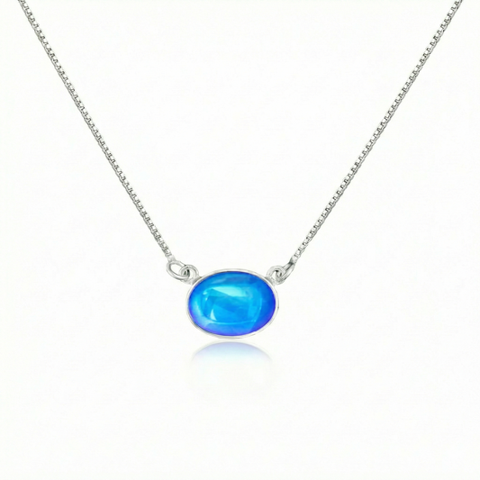 H-Oval Pendant featuring a polished blue stone sleek oval design, this elegant piece exudes sophistication and style. Crafted from high-quality sterling silver. It comes with a 16" sterling silver box chain in a choker design.