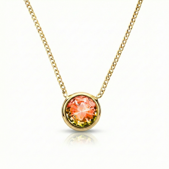  Halo Crystal Necklace, a stunning centerpiece in our Pendant collection that radiates pure elegance. This exquisite necklace showcases a dazzling 9mm fire crystal, durable 18k gold stainless with a 16"-18" adjustable chain.