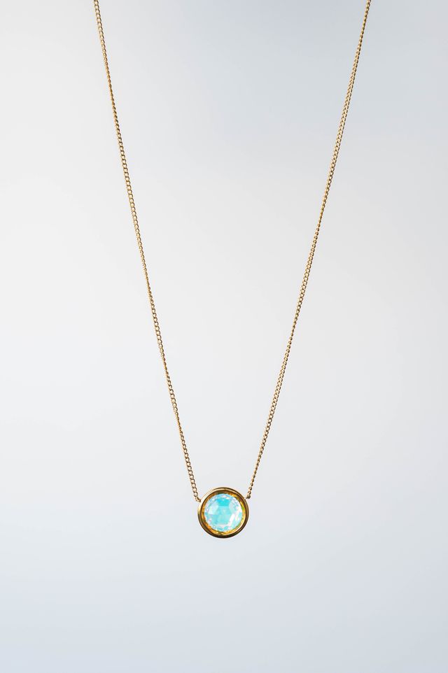 This exquisite necklace showcases a dazzling 9mm crystal, designed to capture and reflect light from every angle, ensuring you shine with every step you take.