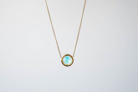 This exquisite necklace showcases a dazzling 9mm crystal, designed to capture and reflect light from every angle, ensuring you shine with every step you take.