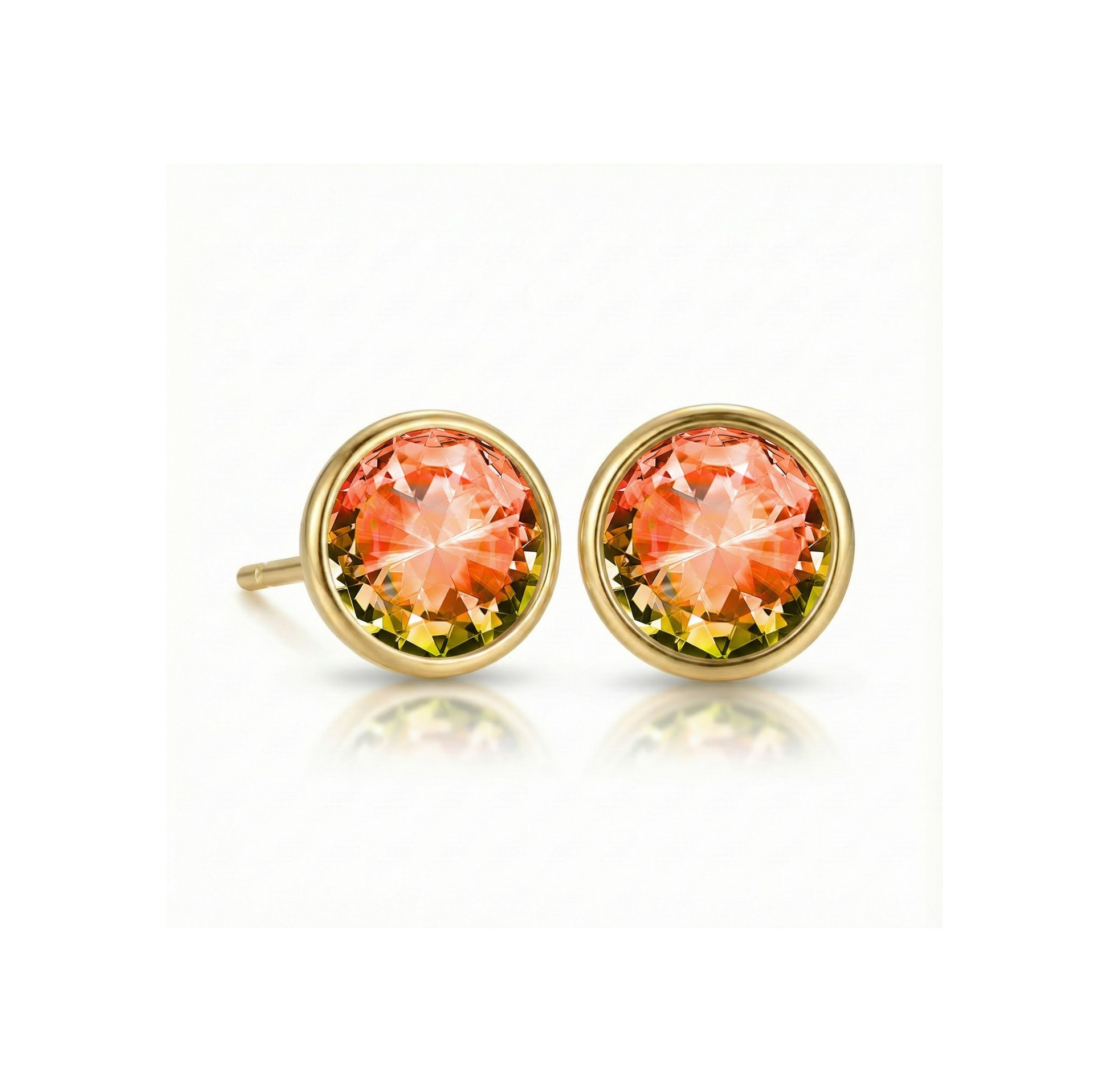 Gold earrings with fire gemstones on a white background