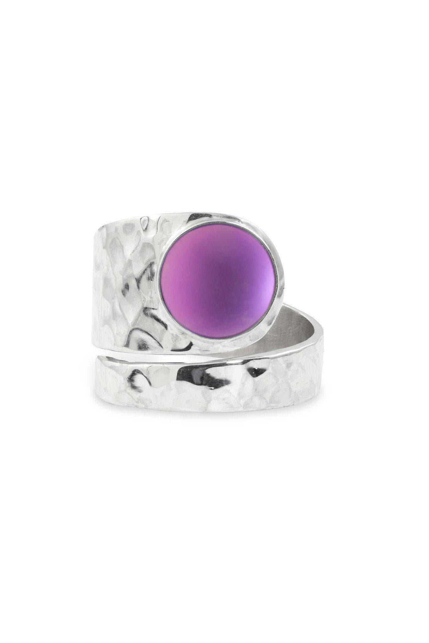 Hammered Single Circle Ring features a stunning crystal, frosted pink stone, and is adjustable. 