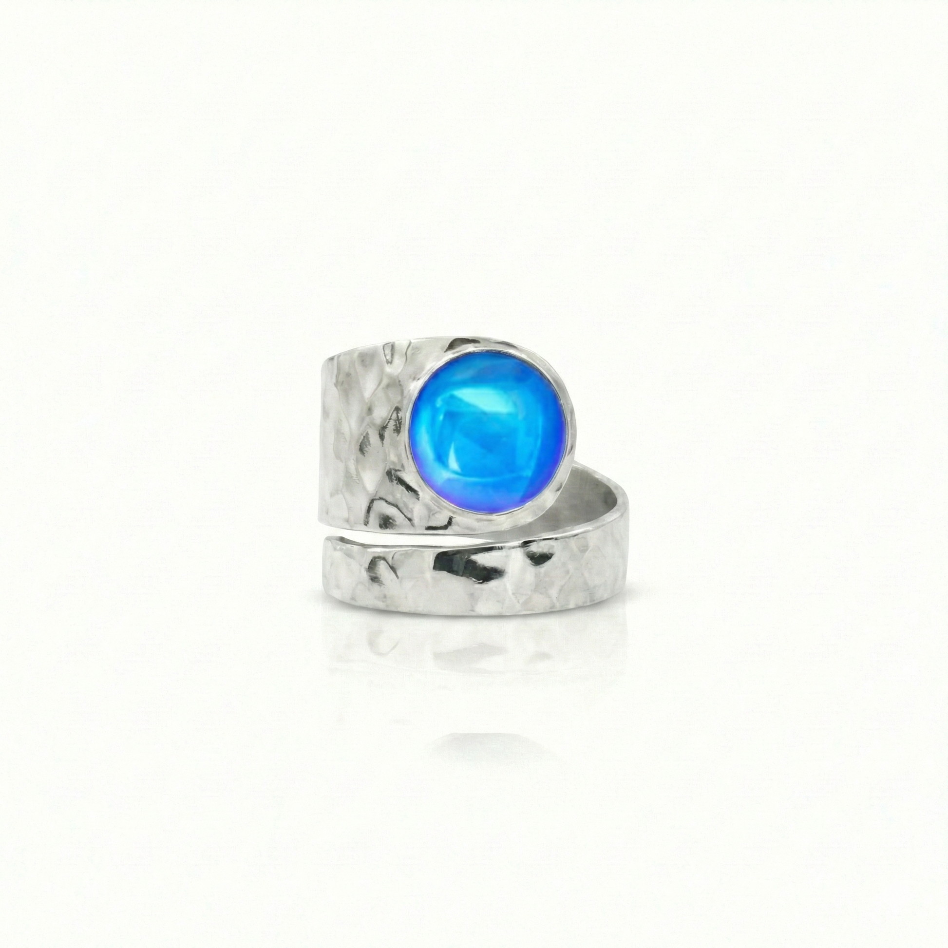 Hammered Single Circle Ring is made of .925 Sterling Silver, features a stunning polished blue crystal stone, and is adjustable.