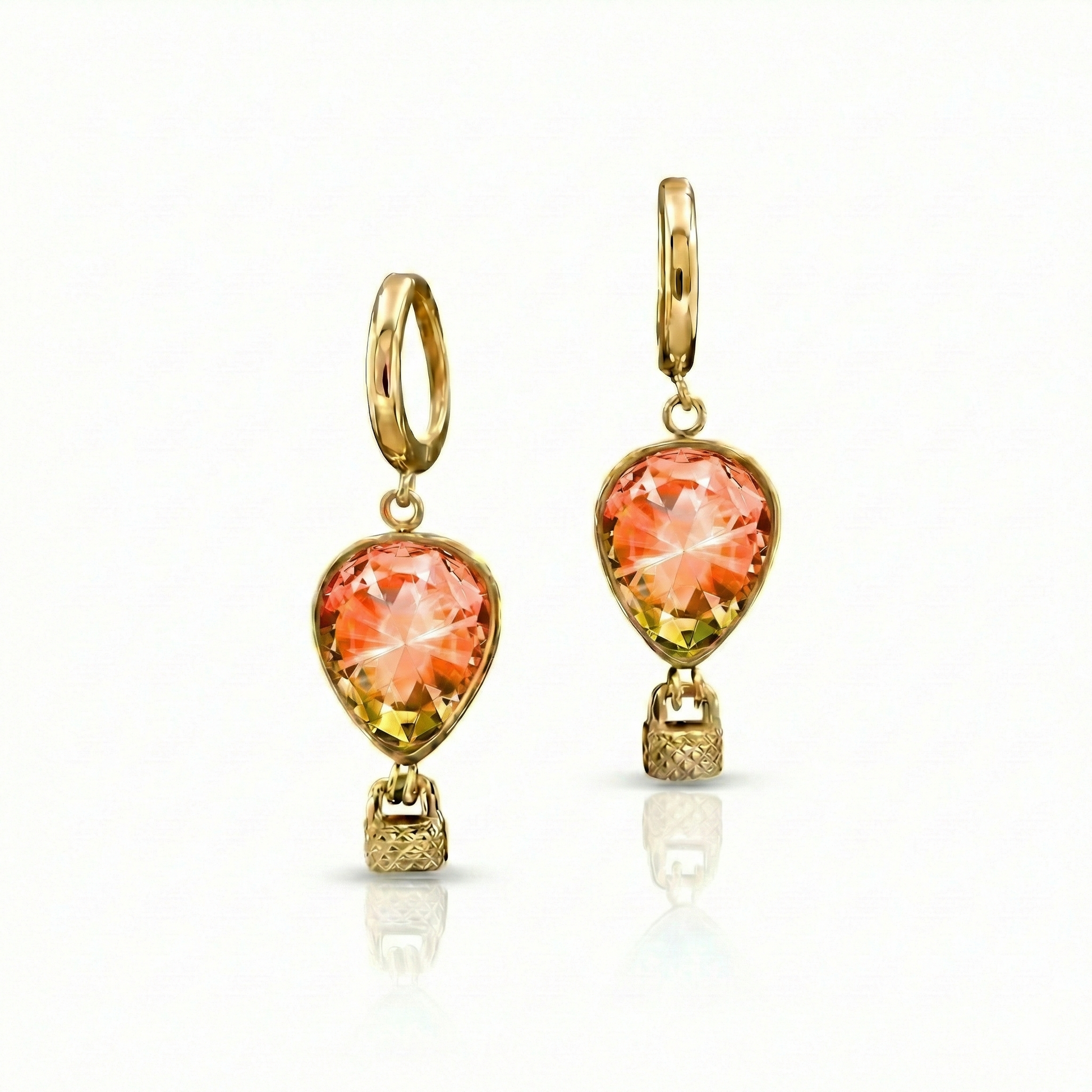 Gold earrings with orange gemstones featuring delicate hot air balloon charms