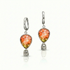 Pair of earrings with orange and yellow teardrop-shaped gemstones featuring delicate hot air balloon charms