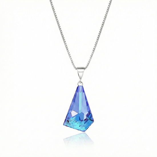  Iridescent Geometric Pendant Inspired by the unique form of sublime glaciers. Crafted with high-quality sterling silver components, this polished blue stone pendant comes with an included 18" sterling silver .7mm box chain for a polished look.