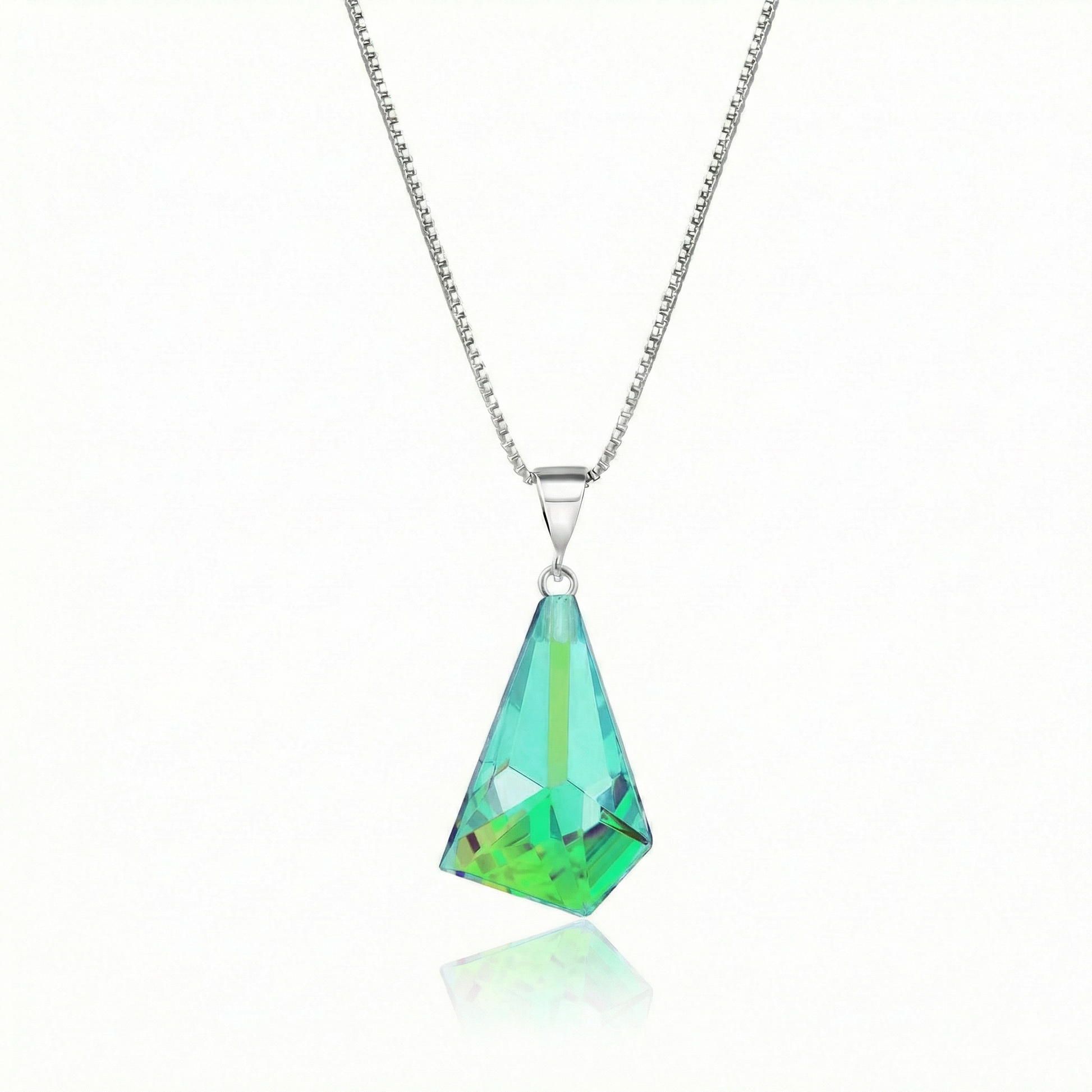  Iridescent Geometric Pendant Inspired by the unique form of sublime glaciers. Crafted with high-quality sterling silver components, this polished green stone pendant comes with an included 18" sterling silver .7mm box chain for a polished look.
