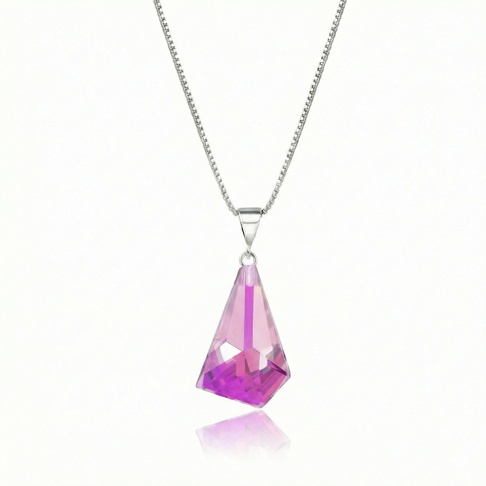 Iridescent Geometric Pendant Inspired by the unique form of sublime glaciers. Crafted with high-quality sterling silver components, this polished pink stone pendant comes with an included 18" sterling silver .7mm box chain for a polished look.