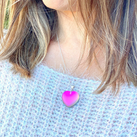 Large Heart Pendant with .925 sterling silver components. It comes with Sterling silver .7mm box chain, 18" included with the frosted pink pendant.