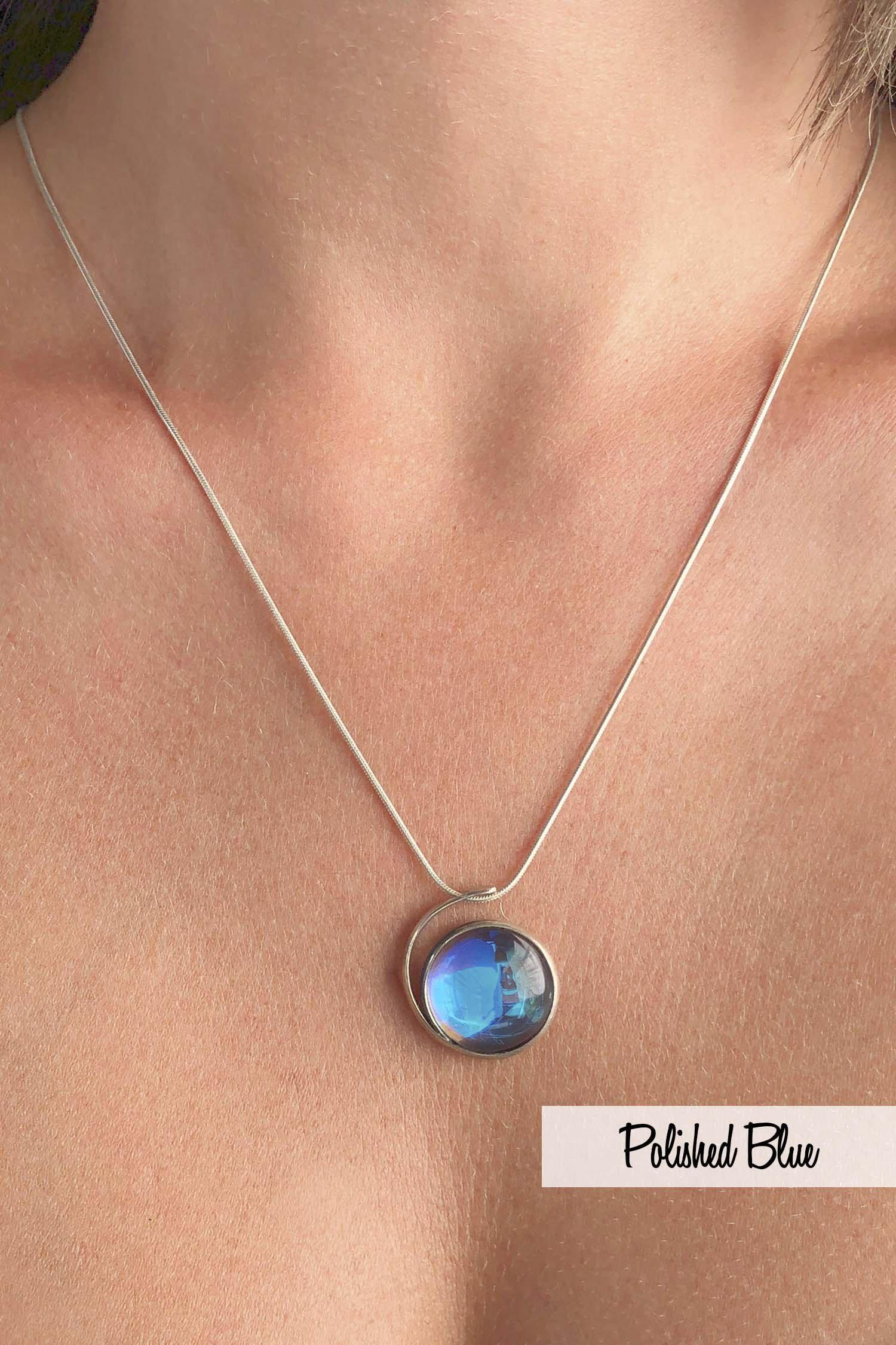 Large Wave Pendant, where it represents the "O" of Ocean Beach, while the surrounding silver symbolizes the "B." Crafted with .925 sterling silver components, the pendant comes with a 1mm sterling silver snake chain, 18" long with a polished blue stone.