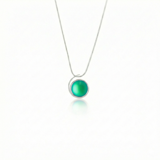 Large Sterling Silver Crystal Wave Pendant, where it represents the "O" of Ocean Beach, while the surrounding silver symbolizes the "B." Crafted with .925 sterling silver components, the pendant comes with a 1mm sterling silver snake chain, 18" long with a frosted green stone.