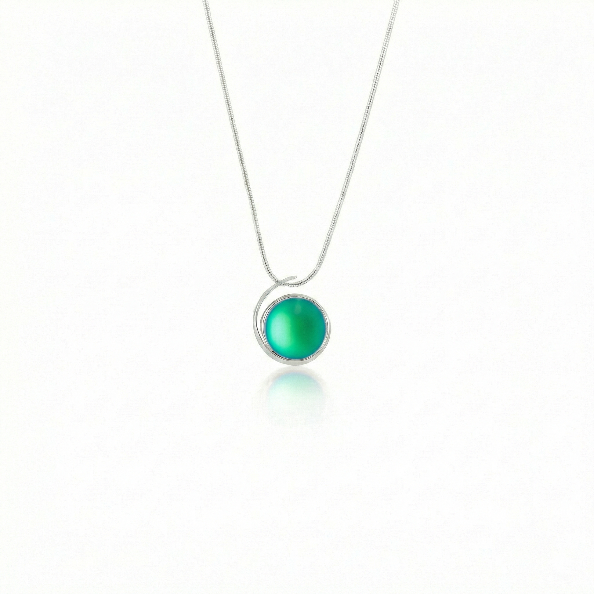 Large Sterling Silver Crystal Wave Pendant, where it represents the "O" of Ocean Beach, while the surrounding silver symbolizes the "B." Crafted with .925 sterling silver components, the pendant comes with a 1mm sterling silver snake chain, 18" long with a frosted green stone.