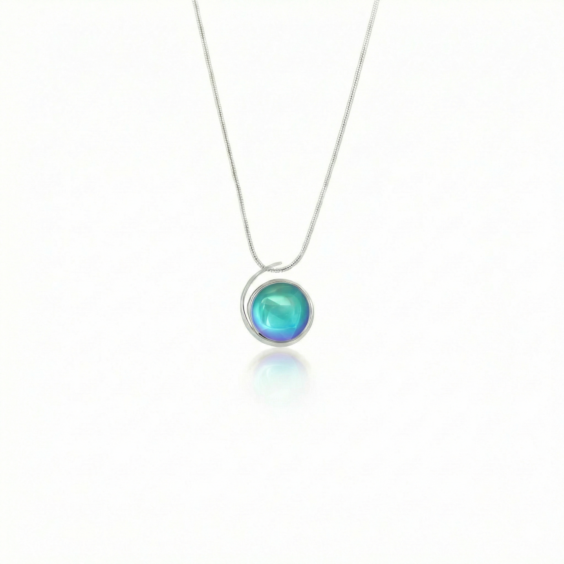 Large Sterling Silver Crystal Wave Pendant where it represents the "O" of Ocean Beach, while the surrounding silver symbolizes the "B." Crafted with .925 sterling silver components, the pendant comes with a 1mm sterling silver snake chain, 18" long with a polished aqua stone.