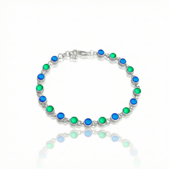 Luminous Crystal Circle Bracelet is made from high-quality sterling silver, ensuring durability and lasting shine with frosted blue, and green stones.