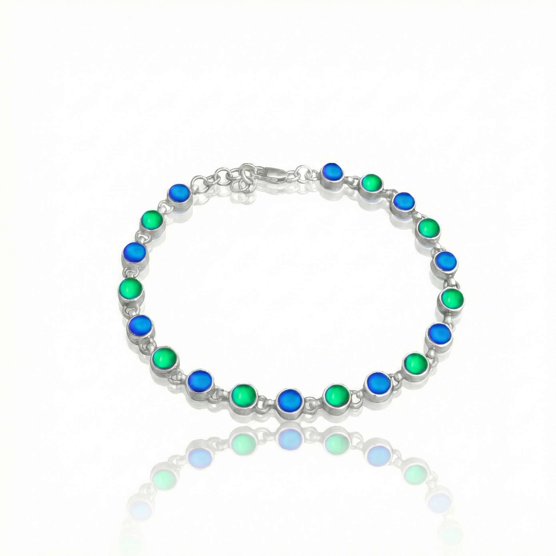 Luminous Crystal Circle Bracelet is made from high-quality sterling silver, ensuring durability and lasting shine with frosted blue, and green stones.
