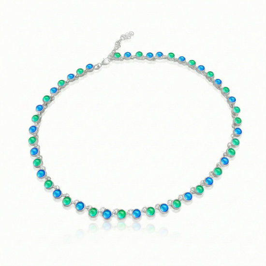 Luminous Crystal Circle Necklace, this beautiful piece is made from high-quality sterling silver and polished blue and green crystals,  ensuring durability and lasting shine. Featuring a 16" choker with adjustable length, it offers a customizable fit for endless styling options.