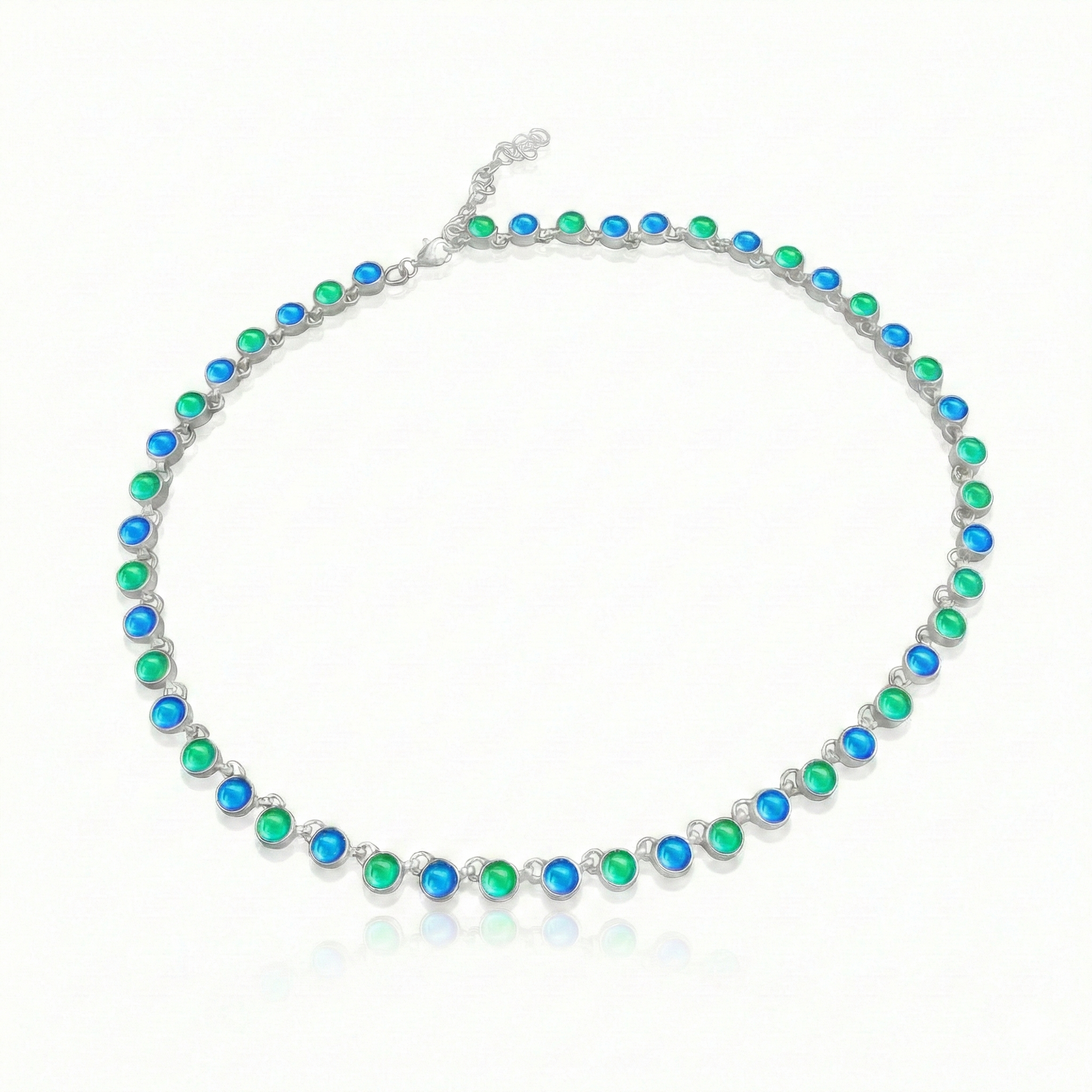 Luminous Crystal Circle Necklace, this beautiful piece is made from high-quality sterling silver and polished blue and green crystals,  ensuring durability and lasting shine. Featuring a 16" choker with adjustable length, it offers a customizable fit for endless styling options.