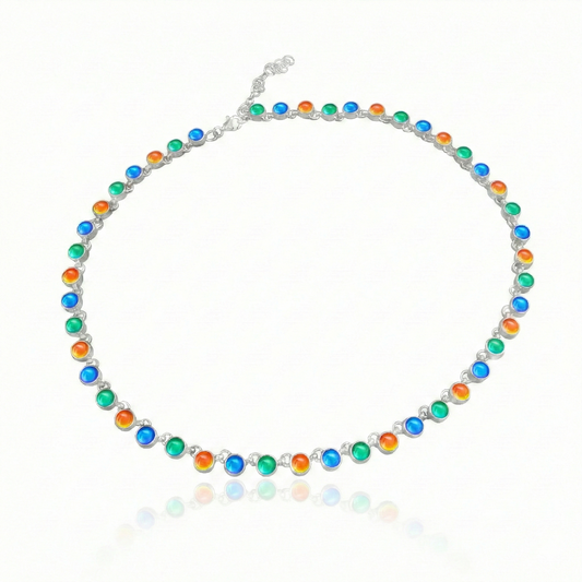 Luminous Crystal Circle Necklace, this beautiful piece is made from high-quality sterling silver and polished blue, green and fire crystals,  ensuring durability and lasting shine. Featuring a 16" choker with adjustable length, it offers a customizable fit for endless styling options.