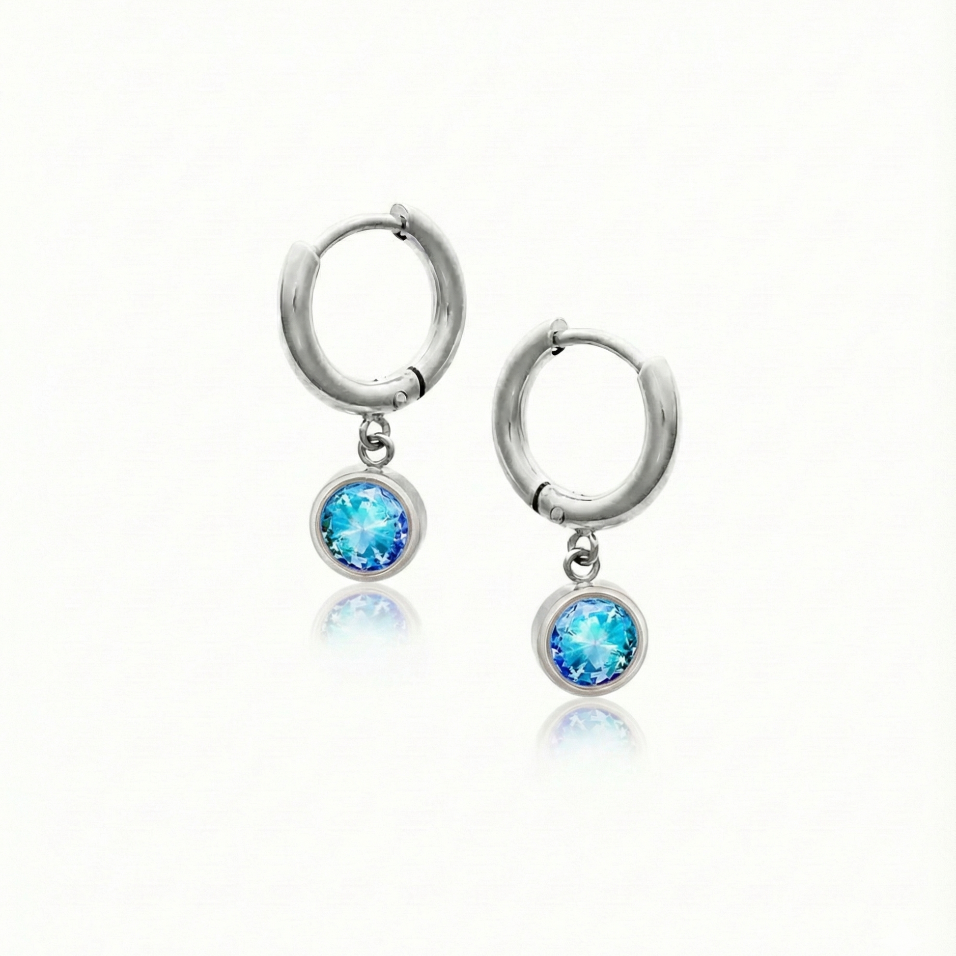 Lunar Hoop Earrings, these earrings feature dainty 5mm blue stone circles with silver stainless.
