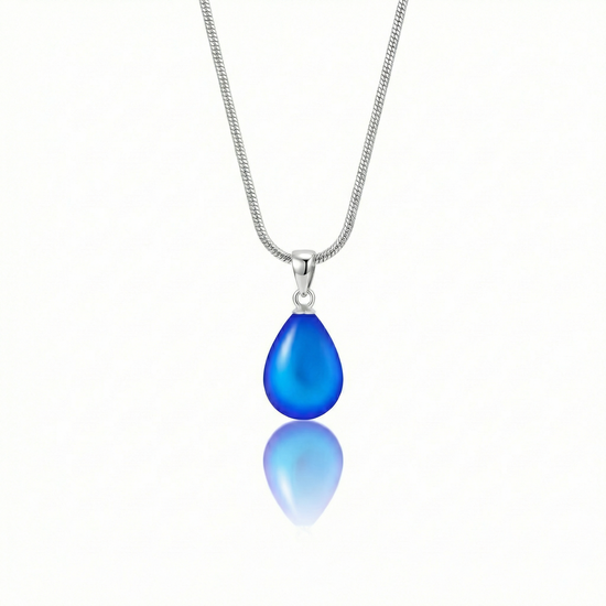 Medium Drop Pendant is a beautiful, simple, and elegant piece that includes an 18" sterling silver 1mm snake chain with the  frosted blue pendant.
