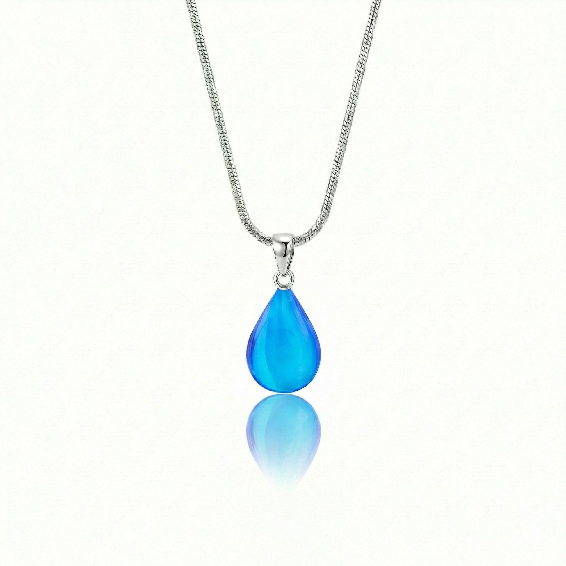 Medium Drop Pendant is a beautiful, simple, and elegant piece that includes an 18" sterling silver 1mm snake chain with the  polished blue pendant.
