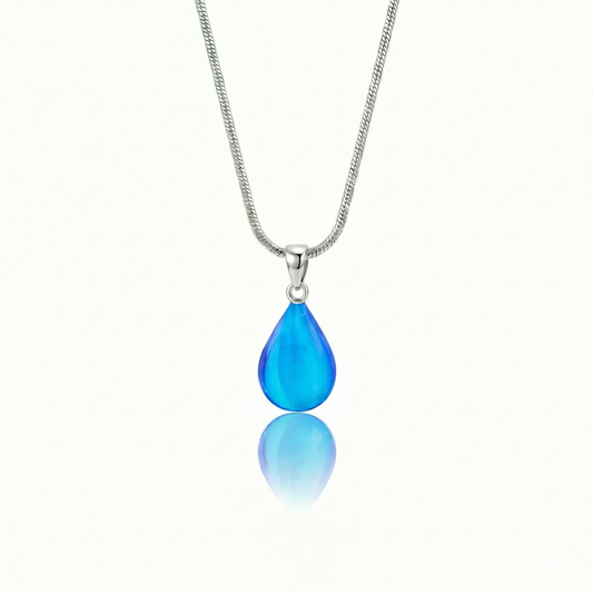 Medium Drop Pendant is a beautiful, simple, and elegant piece that includes an 18" sterling silver 1mm snake chain with the  polished blue pendant.