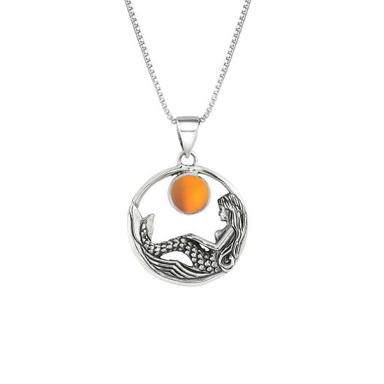 Mermaid Pendant features a beautiful mermaid sitting gracefully beneath a stunning 9mm glowing, frosted fire crystal. The pendant comes with an 18" sterling silver .7mm box chain included.
