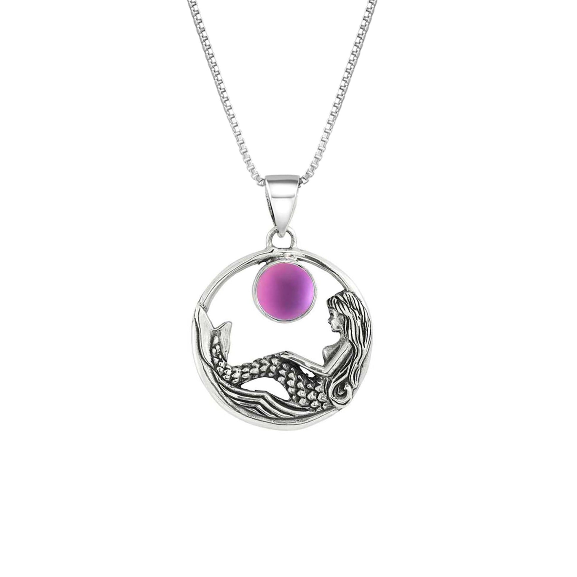 Mermaid Pendant features a beautiful mermaid sitting gracefully beneath a stunning 9mm glowing, frosted pink crystal. The pendant comes with an 18" sterling silver .7mm box chain included.