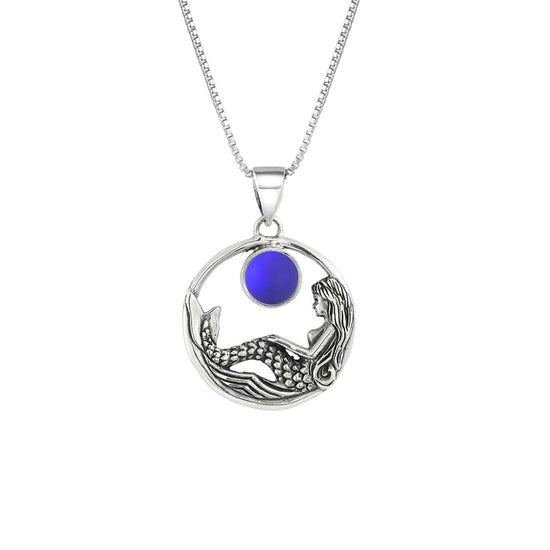 Mermaid Pendant features a beautiful mermaid sitting gracefully beneath a stunning 9mm glowing, frosted violet crystal. The pendant comes with an 18" sterling silver .7mm box chain included.